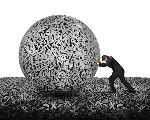 Big data concept. Businessman pushing gray concrete ball of huge amount 3d letters and numbers on 3d characters floor, isolated on white background.