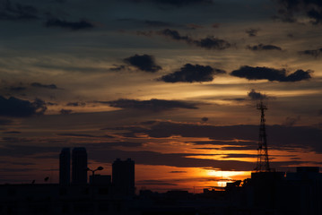 Sun with antenna tower in foreground in twilight time