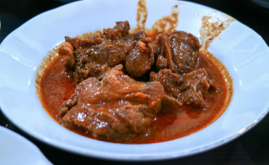 Lamb curry Padang style (gulai cincang) on plate at Padang Restaurant in Jakarta, Indonesia.