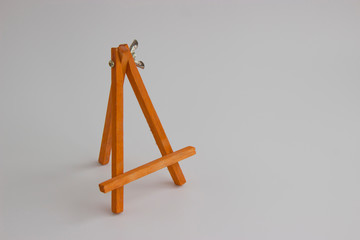 wooden stand for pictures and photos on a light background