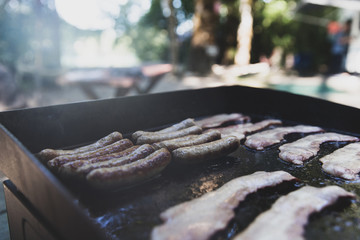 Breakfast cooking on a camp grill outside