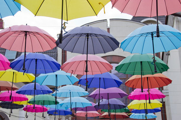 Colorful umbrellas background. Colorful umbrellas in the sky. Street decoration.