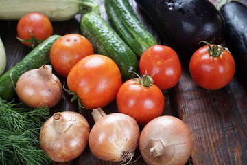 different vegetables on a dark wooden table