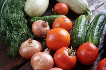 different vegetables on a dark wooden table