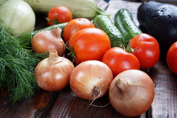 different vegetables on a dark wooden table