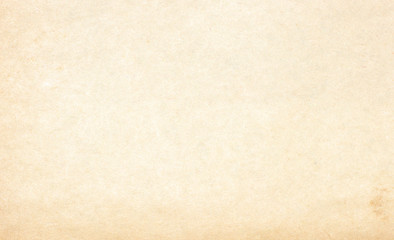 Old vintage paper with a glowing center and grunge vignette.