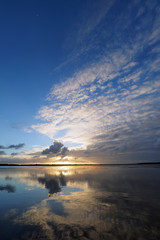 Sunset cloudscape and reflections on Coot Bay in Everglades National Park, Florida on a calm winter evening.