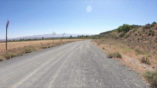 dirt road close to the Reservoir of Cogollos de Guadix, province of Granada, Andalusia, Spain