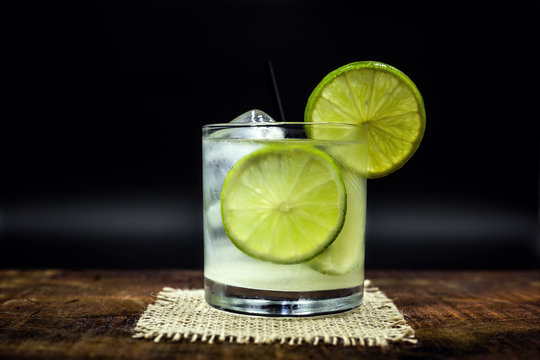 Caipirinha, a typical Brazilian cocktail made with lemon, cachaça and sugar. Brazilian traditional drink, isolated with space for text.