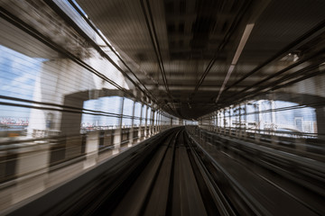 motion-blurred view from a moving train running in tunnel