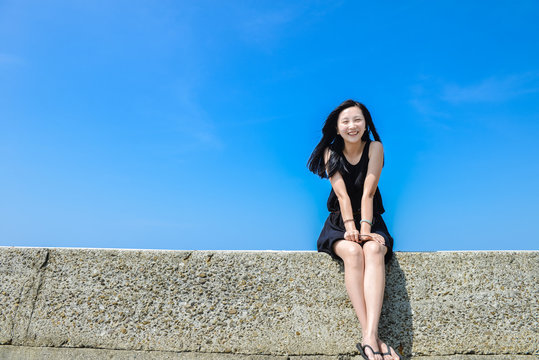 Single Asian girl smiles to camera