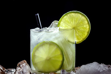 Caipirinha, a typical Brazilian cocktail made with lemon, cachaça and sugar. Brazilian traditional drink, isolated with space for text.