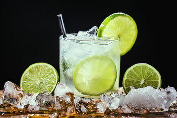 Caipirinha, a typical Brazilian cocktail made with lemon, cachaça and sugar. Brazilian traditional drink, isolated with space for text.