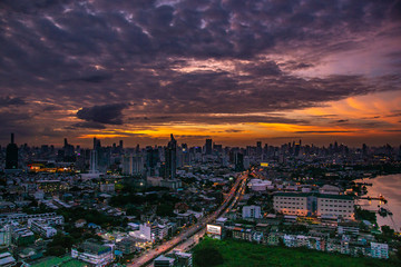 Sky view of Bangkok with skyscrapers in the business district in Bangkok along the Chao Phraya Rive in the during beautiful twilight give the city a modern style.