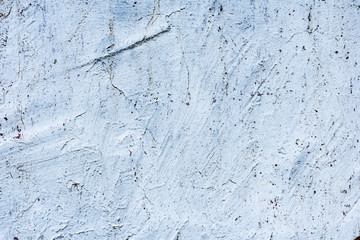 Texture of a concrete wall with cracks and scratches which can be used as a background