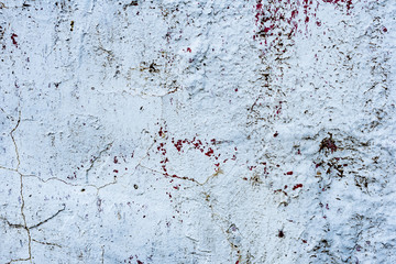 Fototapeta premium Texture of a concrete wall with cracks and scratches which can be used as a background
