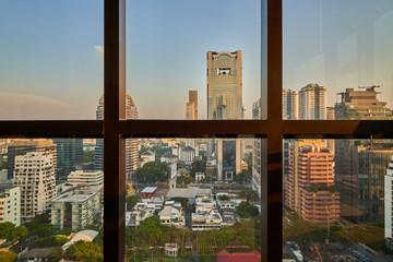cityscape view from window of high building in evening sky