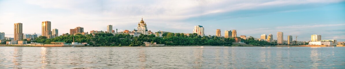 Fototapeta na wymiar View of the city of Khabarovsk from the Amur river. Urban landscape in the evening at sunset.