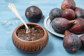 Fig Jam in a Bowl and Fresh Figs, Close Up on a Wooden Background