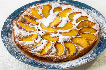 Peach Pie. Homemade Cake  with Peach Slices on a Plate Close Up on White Background