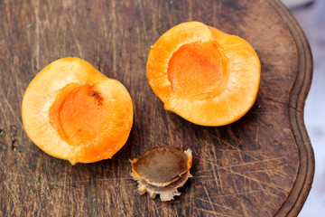 fresh apricots on wooden table