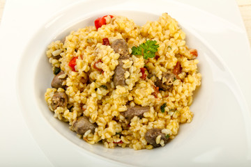 Bulgur with chicken hearts