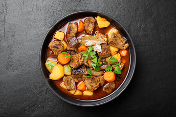 Beef meat  stewed with potatoes, carrots and spices (hungarian goulash).