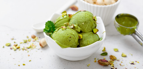 Pistachio ice cream with mint and chopped nuts.
