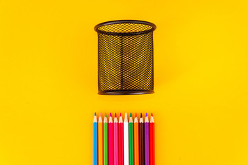 Pencil with pencil box on yellow background