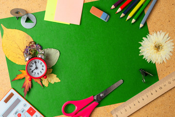 Back to school concept. Alarm clock and school supplies. Copy space.