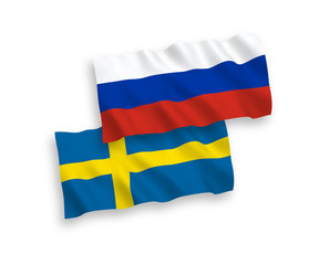 Flags of Sweden and Russia on a white background
