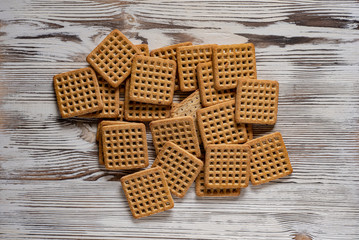 Shortbread cookies on a light wooden background.