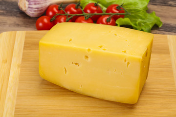 Hard yellow tasty cheese brick