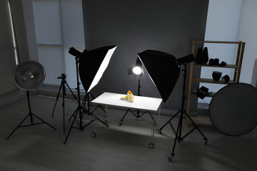 Professional photography equipment prepared for shooting stylish shoes in studio