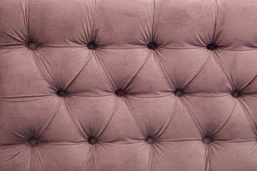 Textures furniture upholstery capitone for background, fabric retro furniture upholstery Chesterfield with buttons, closeup.