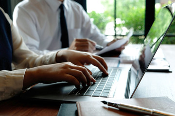 Close-up, businessmen, accountants, businessmen, financiers, bankers, sit and stand near, work, business consulting, business planning, adding ideas and checking accounts