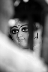 Idol of Hindu Goddess Durga during preparations in Kolkata. Clay idol of Goddess Durga, under...