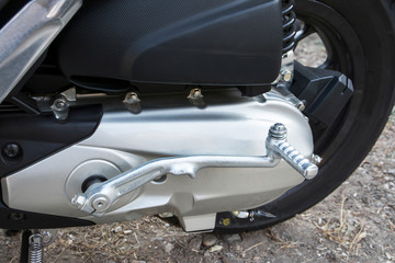 Obraz na płótnie Canvas Back motorcycle starter background. Motorcycle kick starter for engine