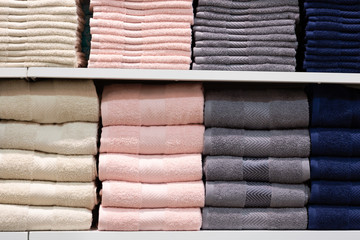 multicolored towels on the shelves