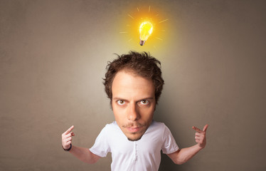 Funny person with big head with new idea concept and lighting bulb