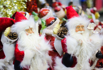 Toy santa claus with gifts on the shelf in the store
