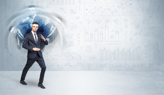 Young businessman in suit fighting with chart and report concept