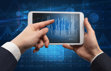 First person hand using tablet and checking financial report on cloud computing system