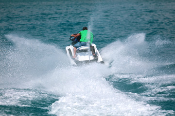 A man rides a water bike in the water