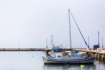 Fototapeta na wymiar Fishing boats in small harbor , Halkidiki Greece