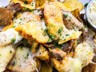 baked potatoes and melted cheese topping