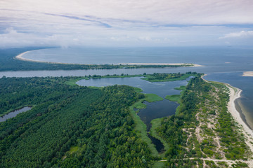 Aerial view of the Vistula river mouth to the Baltic sea. Poland. Photo made by drone from above. Bird eye view.