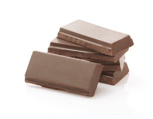 Heap of Dark Brown Chocolate Pieces on White Background