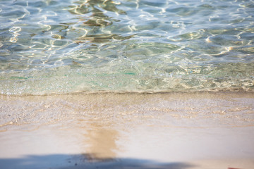 Crystal clear water on a sandy beach in Greece