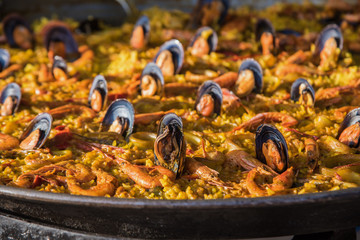 Typical spanish seafood paella in traditional pan close view. Selective focus4